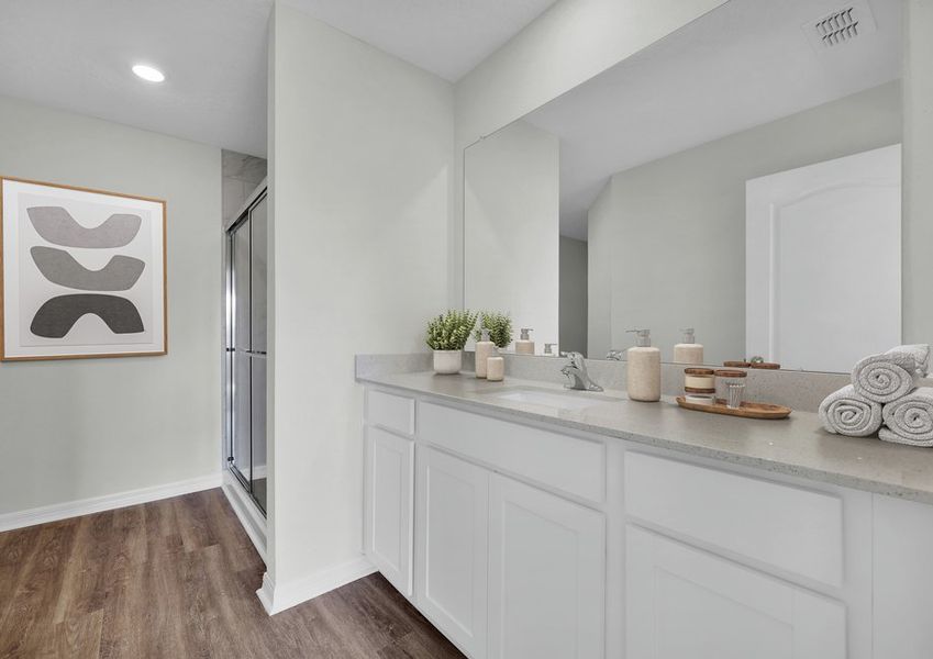 Spread out all of your items you need to get ready for your day on the spacious granite countertop