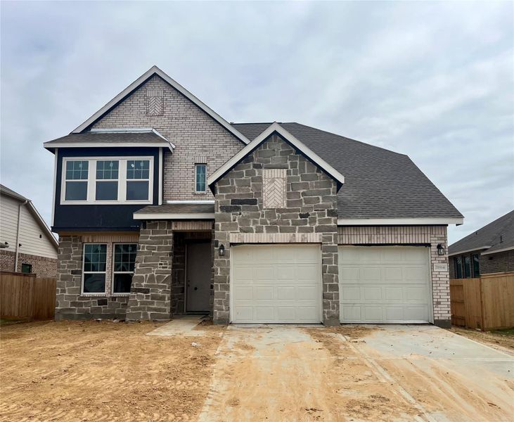 Front exterior of a new home in Oakwood Estates, Waller, TX, highlighting curb appeal (Image 2). Front exterior of a new home in Oakwood Estates, Waller, TX, highlighting curb appeal (Image 2).