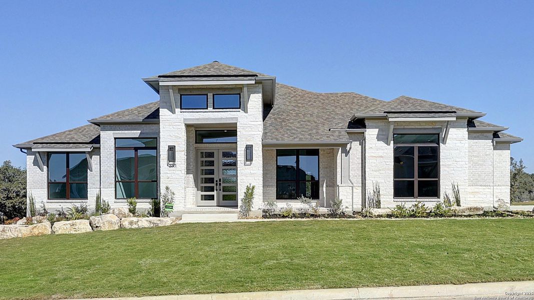 Front exterior of a new home in Megan's Landing 1/2 Acre, Castroville, TX, highlighting curb appeal (Image 1). Front exterior of a new home in Megan's Landing 1/2 Acre, Castroville, TX, highlighting curb appeal (Image 1).