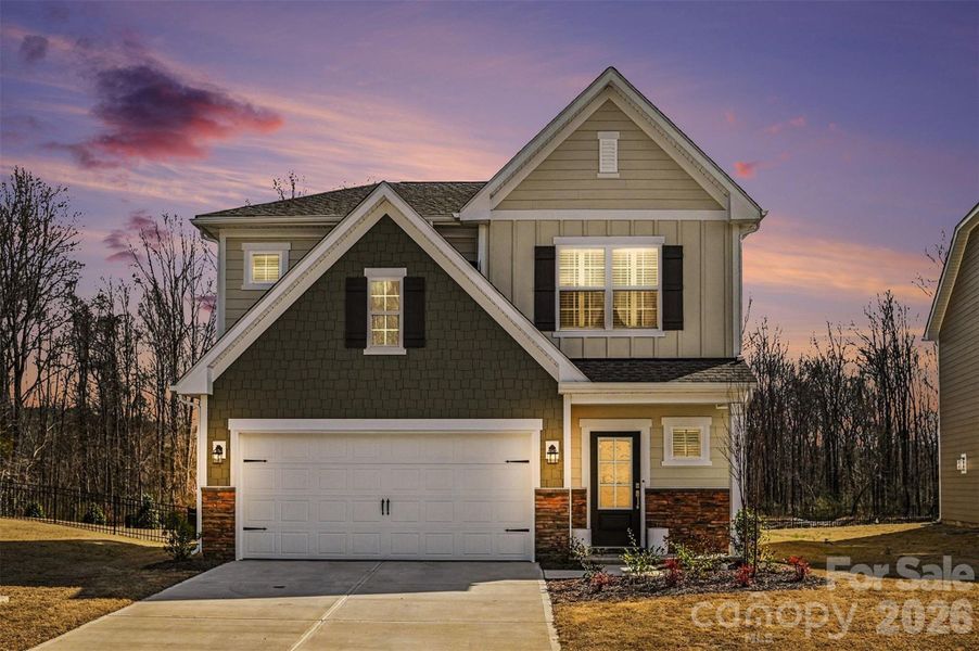 Front exterior of a new home in Summerlyn Village, Kannapolis, NC, highlighting curb appeal (Image 2).