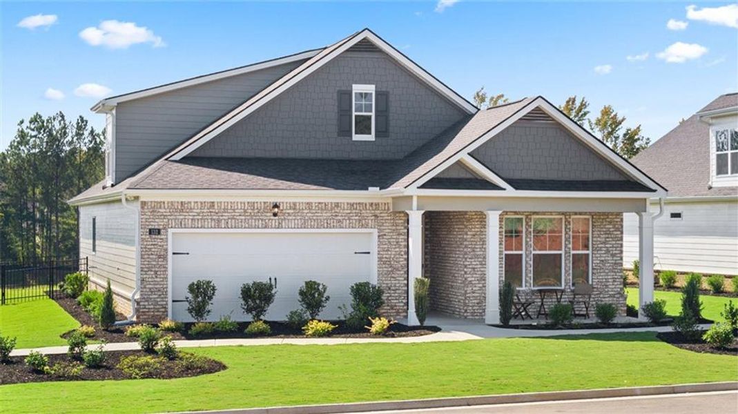 Front exterior of a new home in Oak Ridge Meadows, Locust Grove, GA, highlighting curb appeal (Image 1).