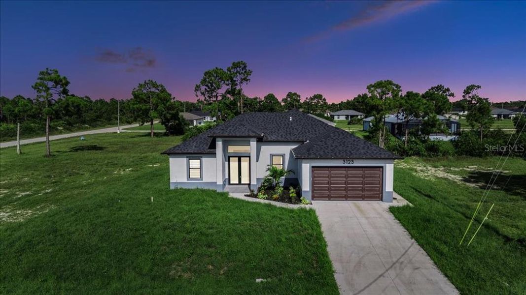 Front exterior of a new home in , Cape Coral, FL, highlighting curb appeal (Image 2).