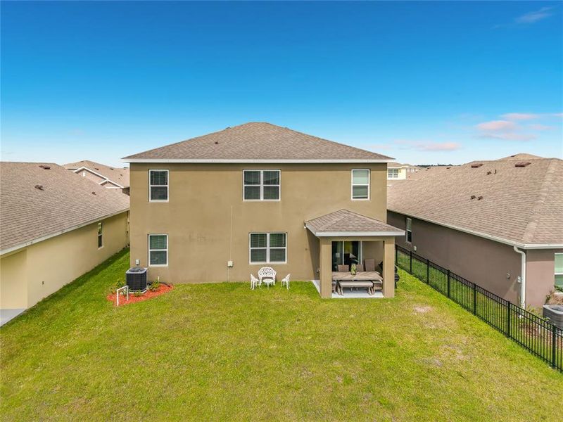 Exterior details and patio area of a home in Cypress Bay West, Palm Bay (Image 30).