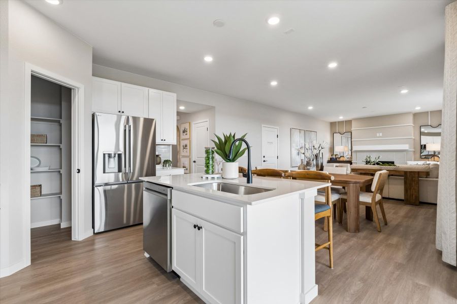 A kitchen with white cabinets. A kitchen with white cabinets.