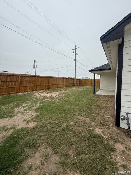 Exterior details and patio area of a home in , Beeville (Image 16).