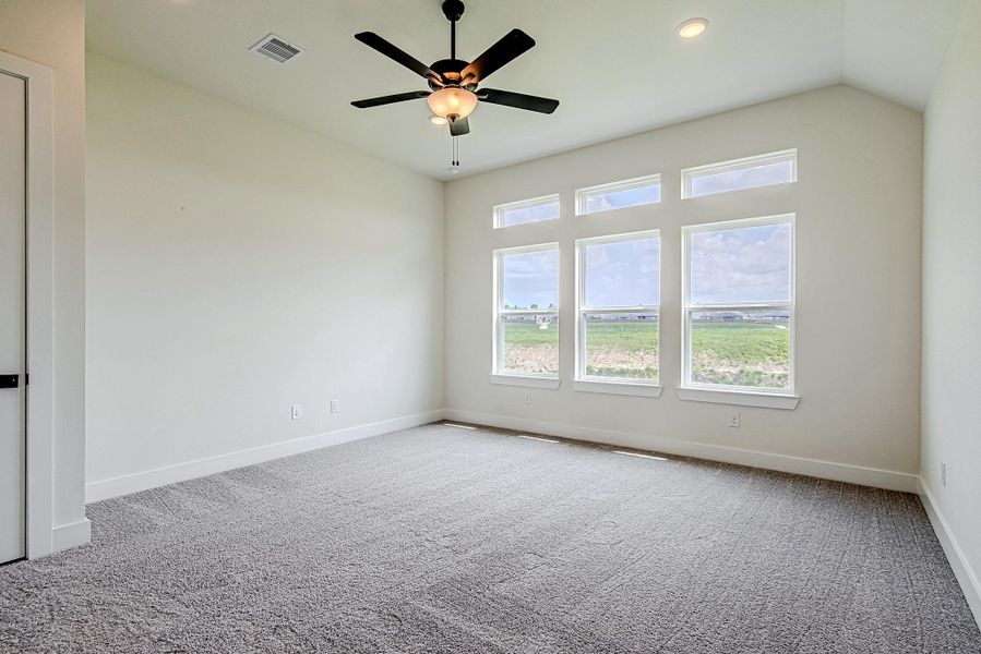 Retreat to the private primary bedroom, offering generous space, natural light, and everyday comfort. Retreat to the private primary bedroom, offering generous space, natural light, and everyday comfort.