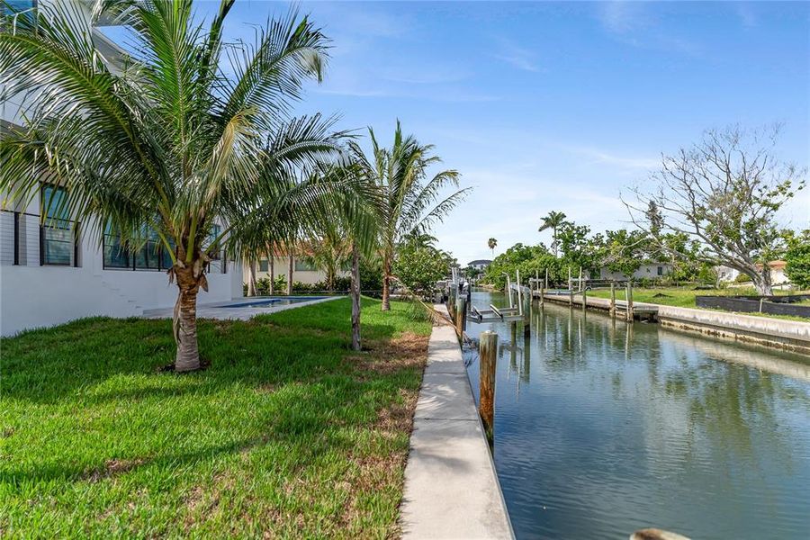 Front exterior of a new home in , Longboat Key, FL, highlighting curb appeal (Image 1). Front exterior of a new home in , Longboat Key, FL, highlighting curb appeal (Image 1).