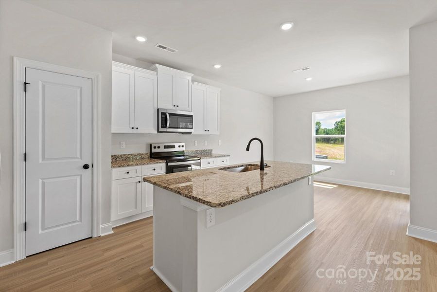 Furnished interior in a model home at Stagecoach Station in Gastonia (Image 5).