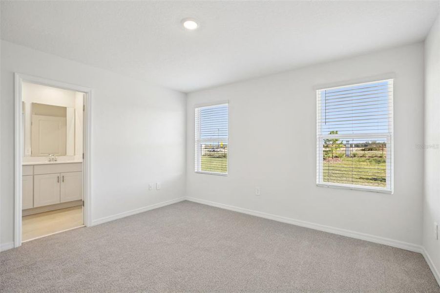 Spacious, unfurnished interior of a new home in The Reserve at Hammock Oaks Townes, Lady Lake (Image 24).