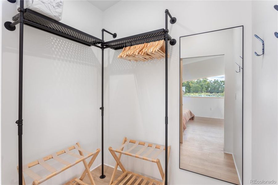 Walk in closet of primary bedroom of Unit 2.