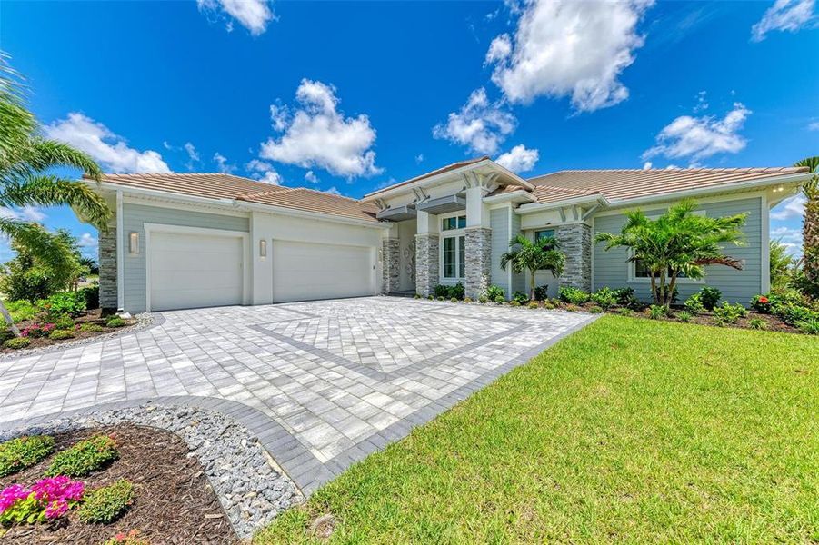 Front exterior of a new home in , Venice, FL, highlighting curb appeal (Image 21).