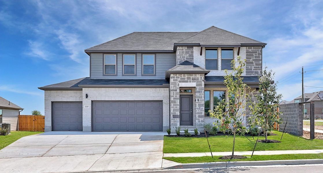 Front exterior of a new home in Prairie Winds, Hutto, TX, highlighting curb appeal (Image 26). Front exterior of a new home in Prairie Winds, Hutto, TX, highlighting curb appeal (Image 26).