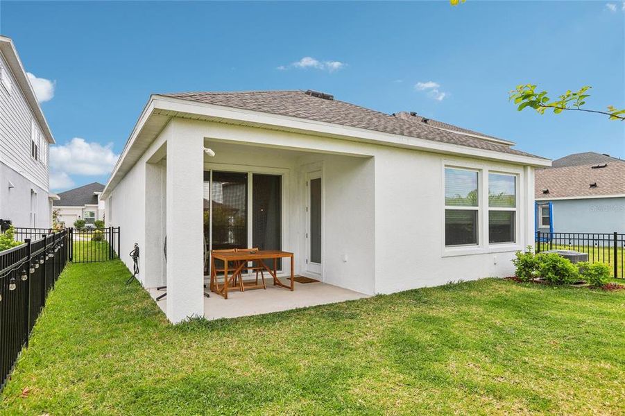 Exterior details and patio area of a home in Waterset Garden Series, Apollo Beach (Image 31).