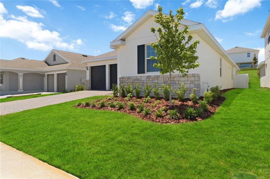 Front exterior of a new home in , Clermont, FL, highlighting curb appeal (Image 24).