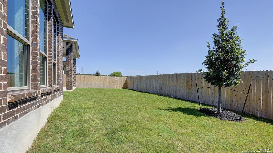 Front exterior of a new home in Kallison Ranch 60', San Antonio, TX, highlighting curb appeal (Image 16).