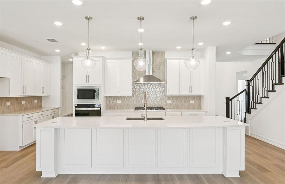 Spacious kitchen with eat-in bartop island Spacious kitchen with eat-in bartop island