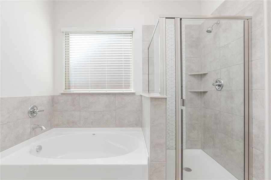 Bathroom featuring independent shower and bath