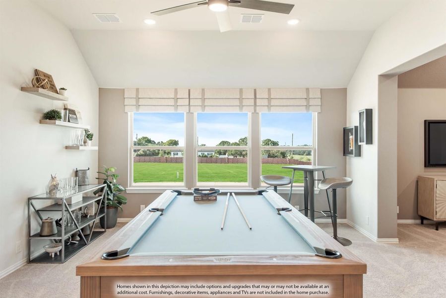 Game room with pool table, ceiling fan, floating shelves, and large windows overlooking a backyard
