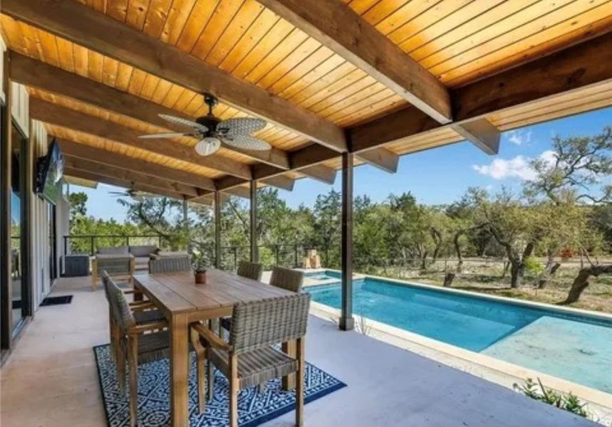 View of patio featuring an outdoor pool, ceiling fan, and outdoor dining space View of patio featuring an outdoor pool, ceiling fan, and outdoor dining space