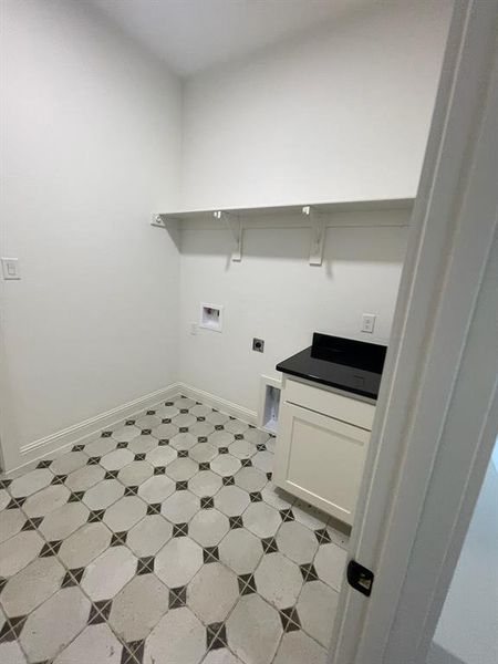 Laundry area featuring hookup for an electric dryer, baseboards, and hookup for a washing machine Laundry area featuring hookup for an electric dryer, baseboards, and hookup for a washing machine