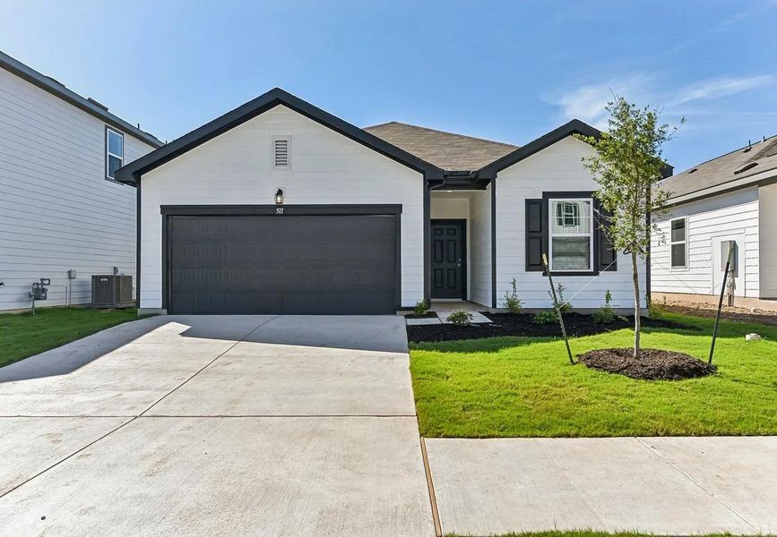 Front exterior of a new home in The Trails at Carmel, Pflugerville, TX, highlighting curb appeal (Image 2). Front exterior of a new home in The Trails at Carmel, Pflugerville, TX, highlighting curb appeal (Image 2).