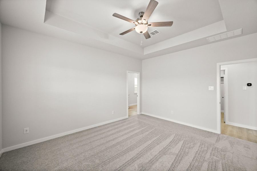 Spacious, unfurnished interior of a new home in Sunterra, Katy (Image 26).