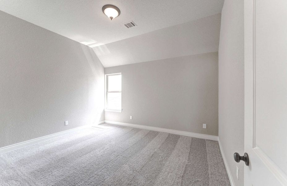 Representative unfurnished interior of a home built from the 3799 by Ravenna Homes in Artavia 70′, Conroe (Image 49).