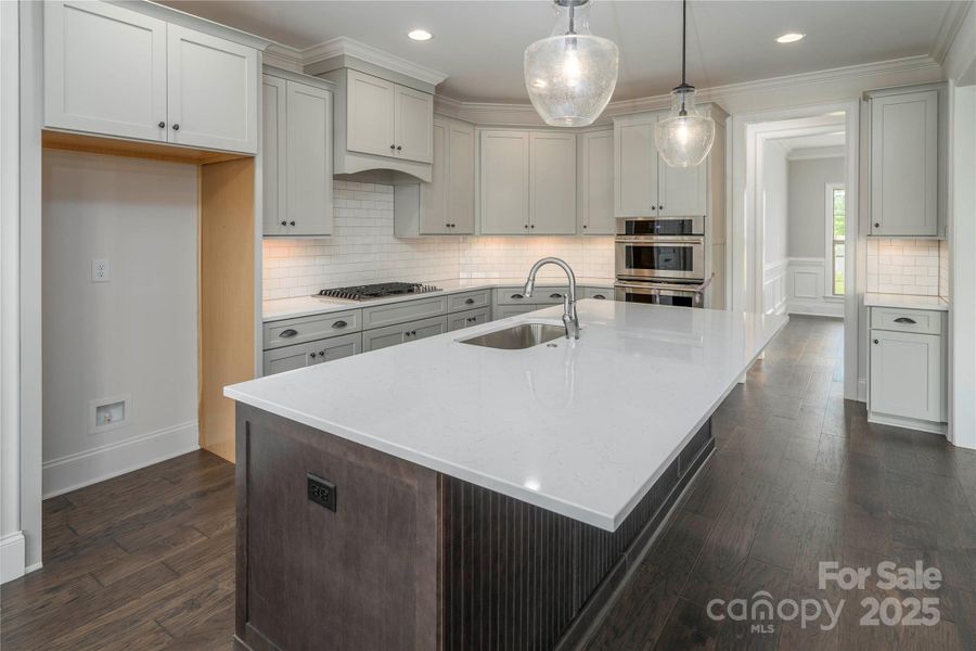 Please Note Photos are of completed home with similar finishes.   Plan to be reversed on this homesite