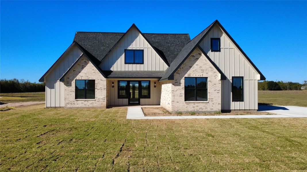 Front exterior of a new home in , Sealy, TX, highlighting curb appeal (Image 1). Front exterior of a new home in , Sealy, TX, highlighting curb appeal (Image 1).