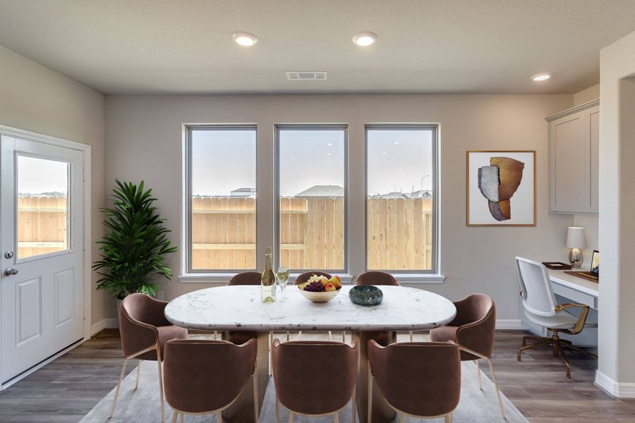 Dining room. Note: Sample product photo - actual exterior and interior selections may vary by homesite