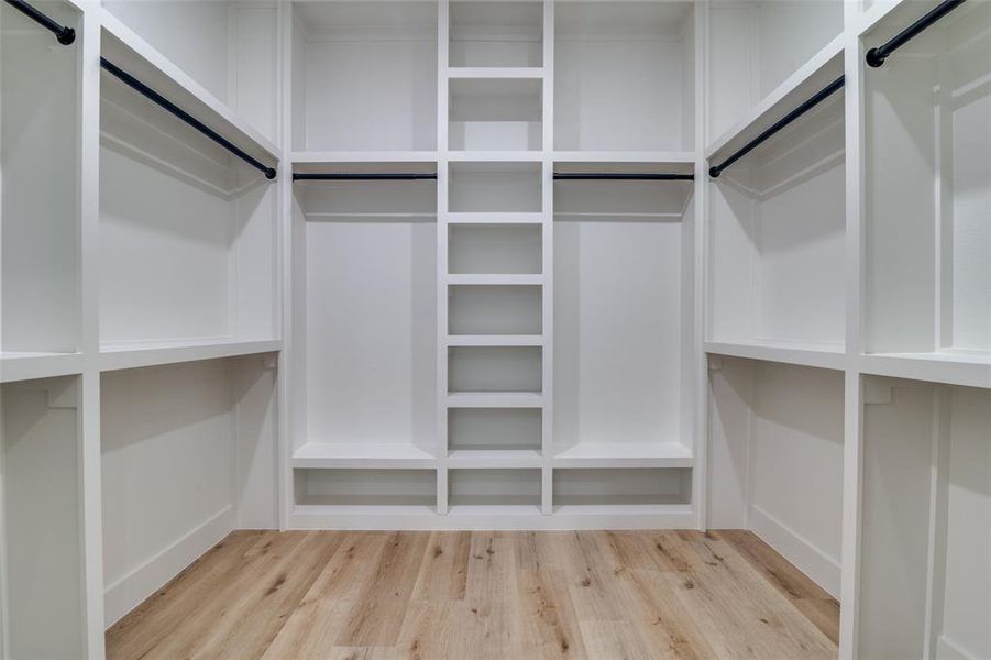 Walk in closet featuring light wood finished floors