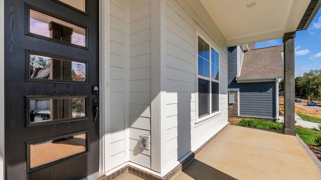 Covered front porch and front door to home (Representative of completed home)