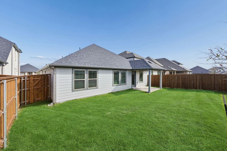 Covered Patio in the Emmy II home plan by Trophy Signature Homes - REPRESENTATIVE PHOTO