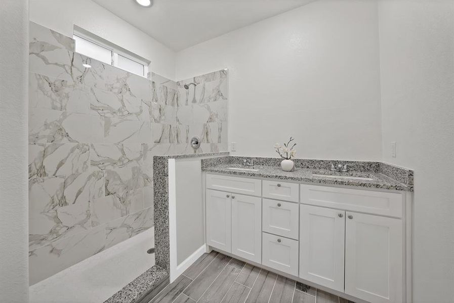 Bathroom with a walk in shower and double vanity