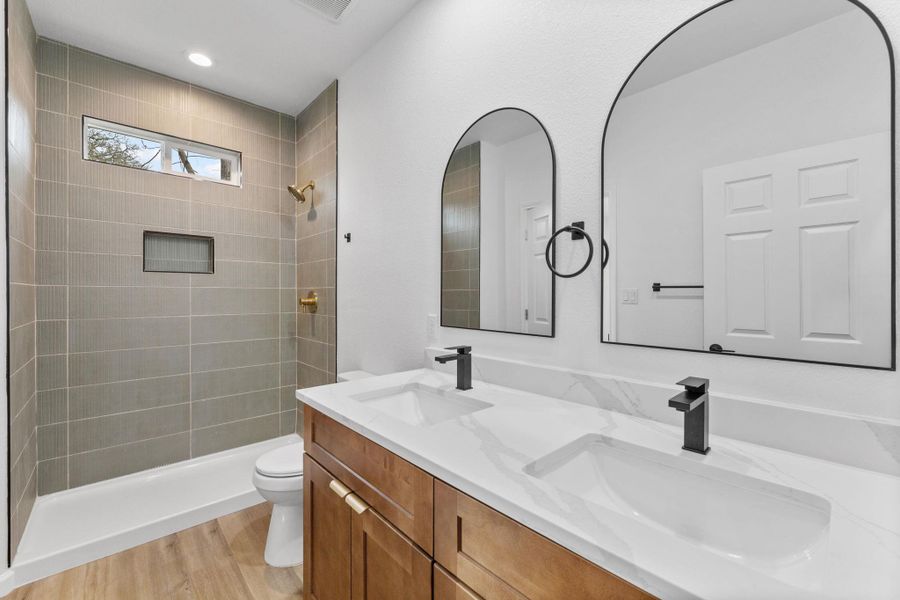 Bathroom with tiled shower, double vanity Bathroom with tiled shower, double vanity