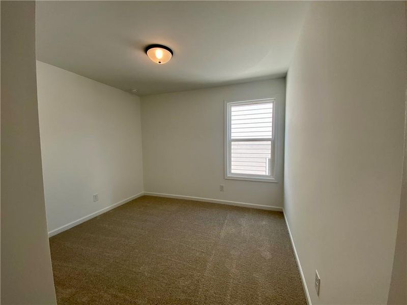 Spacious, unfurnished interior of a new home in Eastlyn Crossing, Flowery Branch (Image 25).