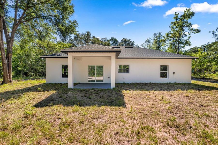 Exterior details and patio area of a home in , Summerfield (Image 19).