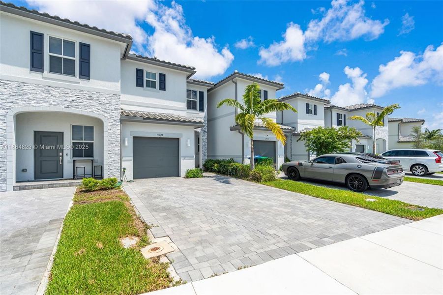 Front exterior of a new home in , Coral Springs, FL, highlighting curb appeal (Image 2).