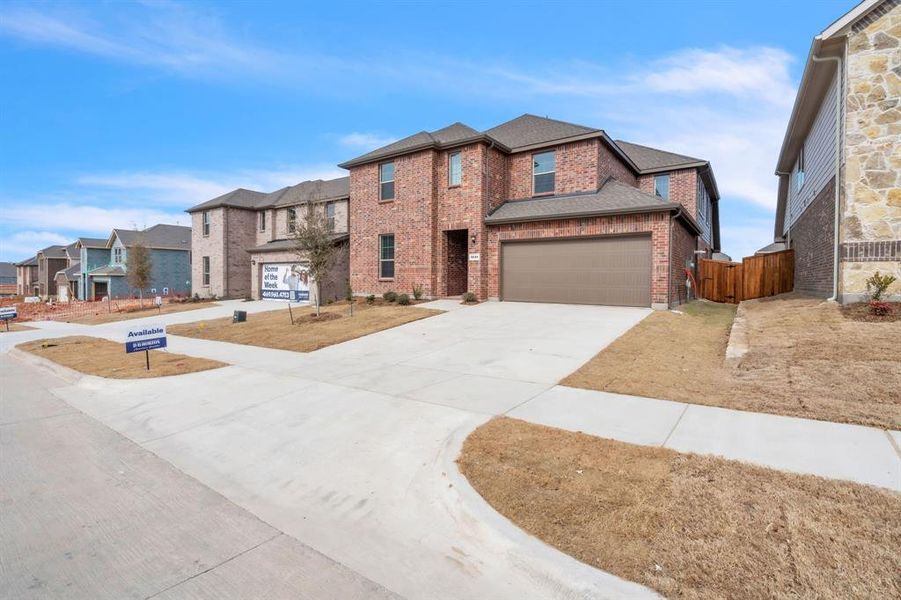 Front exterior of a new home in The Landing at Hidden Lakes, McKinney, TX, highlighting curb appeal (Image 2).