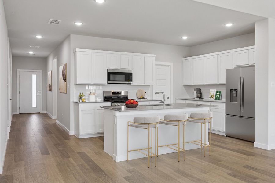 Kitchen in the Masters home plan by Trophy Signature Homes – REPRESENTATIVE PHOTO
