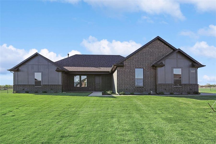 View of front of property featuring a front lawn