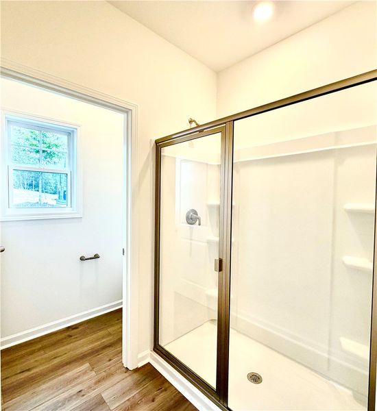 Clean lines and warm wood floors define this moder