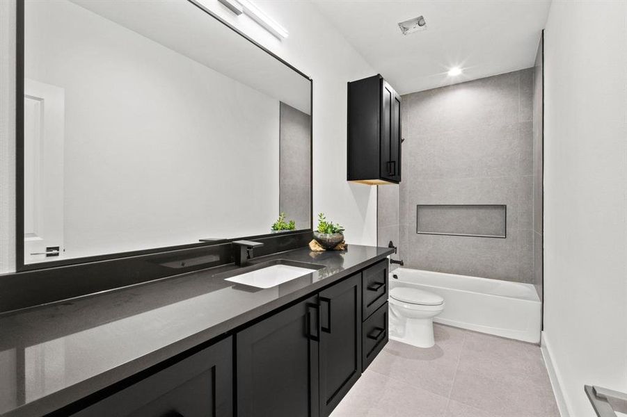 Full bath with vanity, light tile patterned floors, shower / tub combination, and recessed lighting