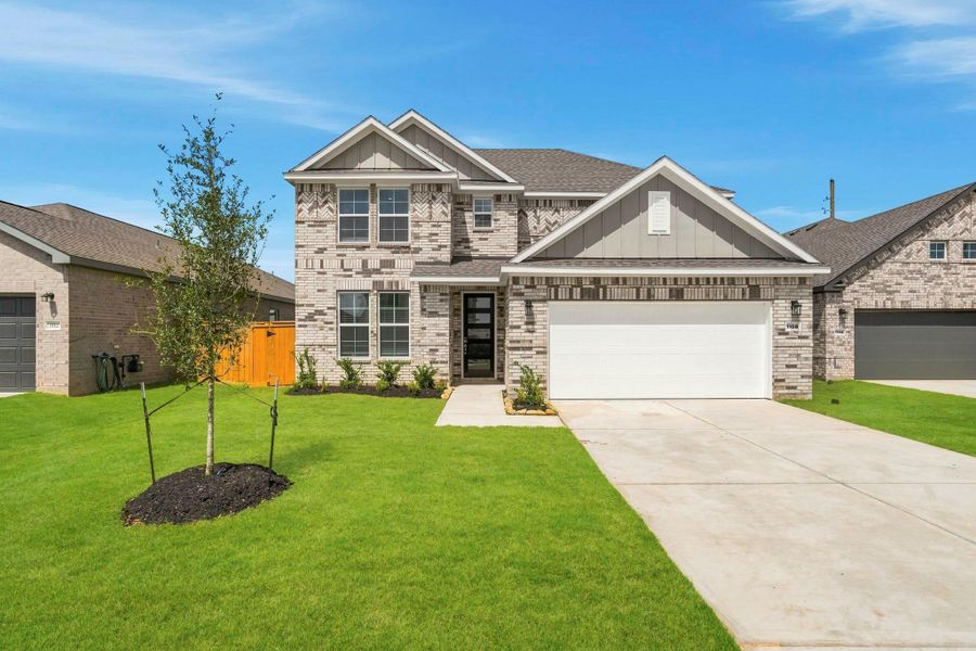 Front exterior of a new home in Sunterra Lakes, Brookshire, TX, highlighting curb appeal (Image 2). Front exterior of a new home in Sunterra Lakes, Brookshire, TX, highlighting curb appeal (Image 2).
