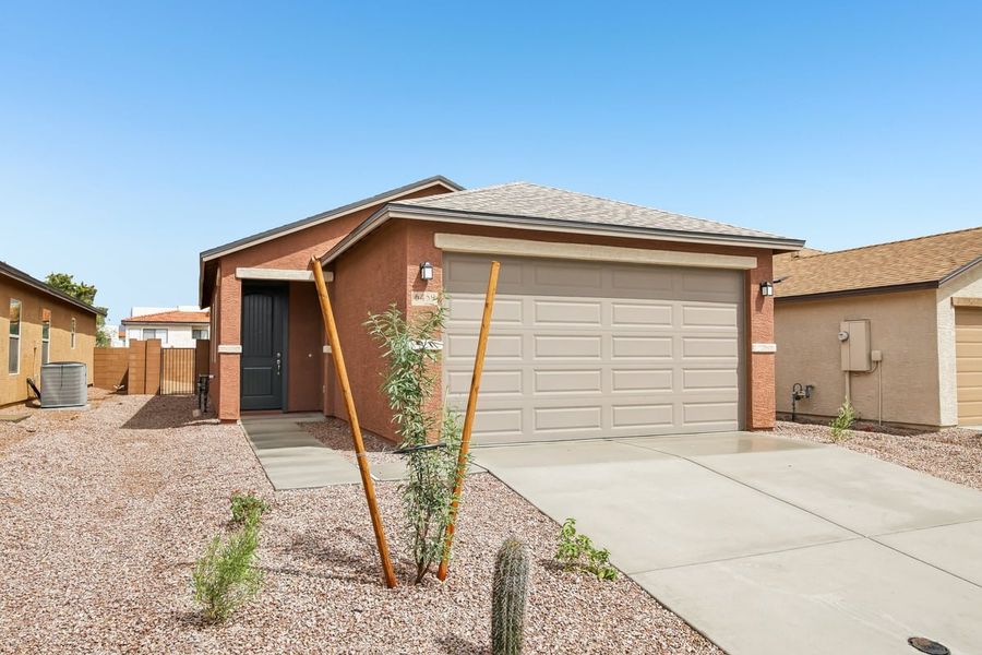 Front exterior of a new home in Saguaro Haven, Tucson, AZ, highlighting curb appeal (Image 1). Front exterior of a new home in Saguaro Haven, Tucson, AZ, highlighting curb appeal (Image 1).
