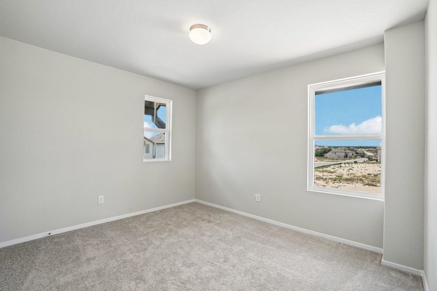 Spacious, unfurnished interior of a new home in Hunters Ranch, San Antonio (Image 20).