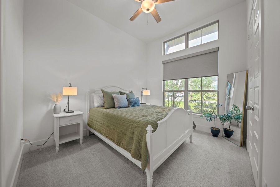Spacious secondary bedroom with a high ceiling and plenty of natural light. Comfortable and versatile. Spacious secondary bedroom with a high ceiling and plenty of natural light. Comfortable and versatile.