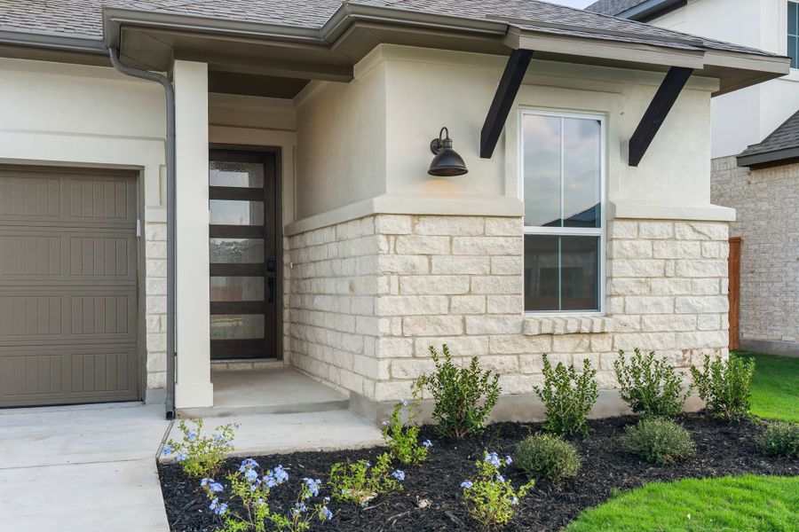 Exterior details and patio area of a home in Lariat, Liberty Hill (Image 3).
