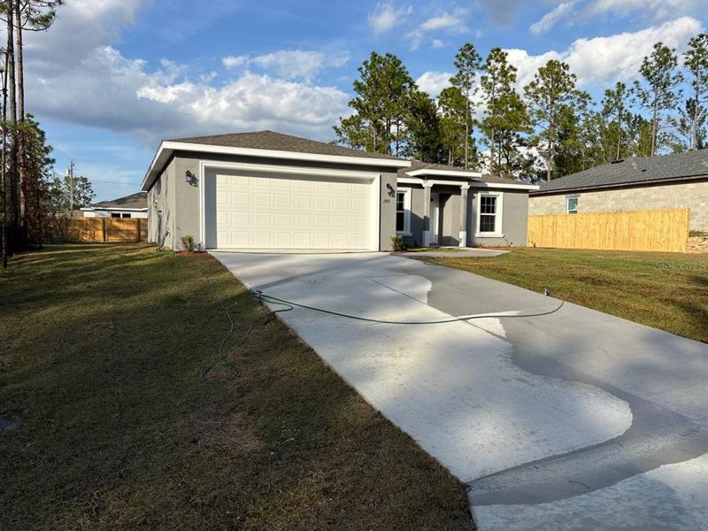 Front exterior of a new home in , Citrus Springs, FL, highlighting curb appeal (Image 2).