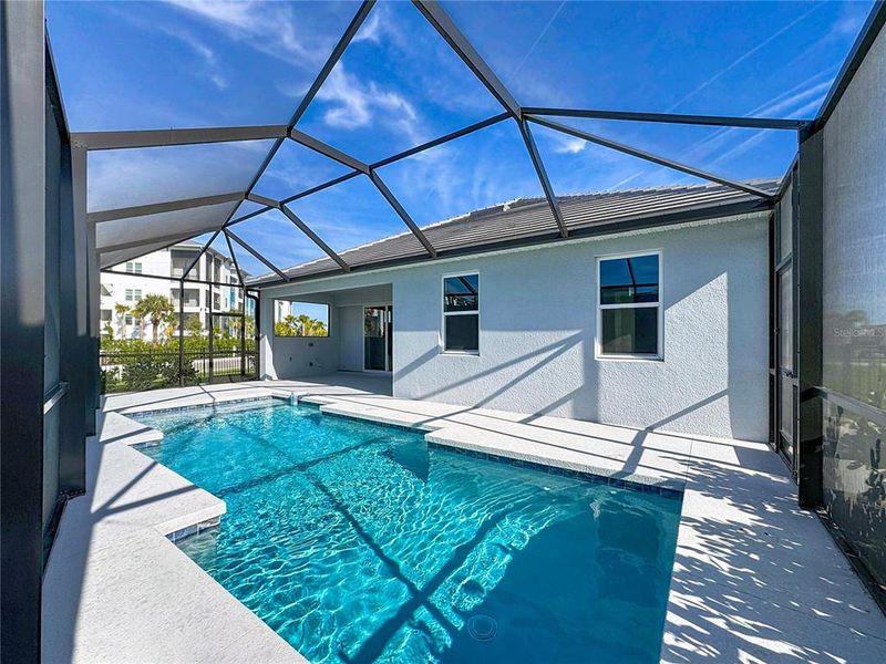 Exterior details and patio area of a home in Watercolor Place, Bradenton (Image 29).